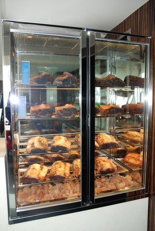 The Landis Taichung Hotel Exterior photo A display of meat maturing in a dry-aging fridge